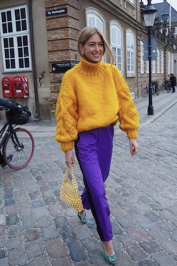 Girl wearing blue and yellow outfit